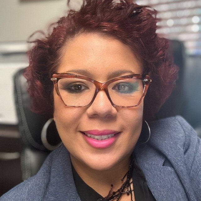 Maxine Gladden, publisher of The Verified Register, at her desk